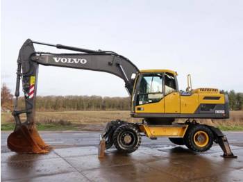 Mobiele graafmachine Volvo EW205D BLADE+OUTRIGGERS (3146 HOURS): afbeelding 1