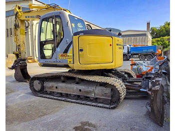 Rupsgraafmachine NEW HOLLAND