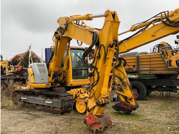 Rupsgraafmachine NEW HOLLAND
