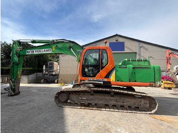 Rupsgraafmachine NEW HOLLAND