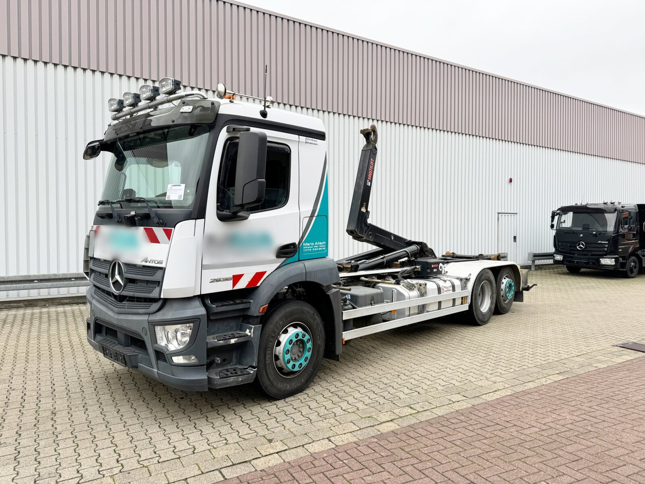 Mercedes-Benz Antos 2536/43 L 6x2 Antos 2536/43 L 6x2, Liftachse, Hiab XR 21S61 bis 7 m Container - Haakarmsysteem vrachtwagen: afbeelding 1 Mercedes-Benz Antos 2536/43 L 6x2 Antos 2536/43 L 6x2, Liftachse, Hiab XR 21S61 bis 7 m Container - Haakarmsysteem vrachtwagen: afbeelding 1