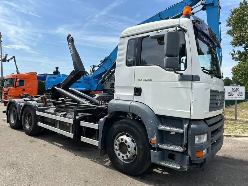 MAN TGA 33.360 6x4 HOOKLIFT - MANUAL ZF - BIG AXLES HUB REDUCTION / STEEL SPRING - BE TRUCK - Haakarmsysteem vrachtwagen: afbeelding 1 MAN TGA 33.360 6x4 HOOKLIFT - MANUAL ZF - BIG AXLES HUB REDUCTION / STEEL SPRING - BE TRUCK - Haakarmsysteem vrachtwagen: afbeelding 1