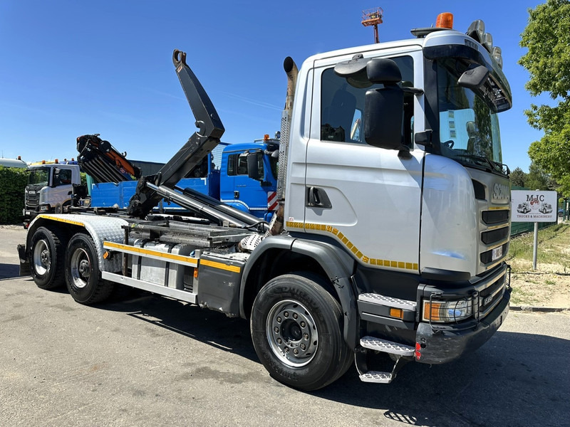 Scania G450 6x4 HOOKLIFT AJK 20T - 5760mm - 3m90 WB - HUB REDUCTION / STEEL SUSP. - EURO 6 - BE TRUCK - Haakarmsysteem vrachtwagen: afbeelding 1 Scania G450 6x4 HOOKLIFT AJK 20T - 5760mm - 3m90 WB - HUB REDUCTION / STEEL SUSP. - EURO 6 - BE TRUCK - Haakarmsysteem vrachtwagen: afbeelding 1
