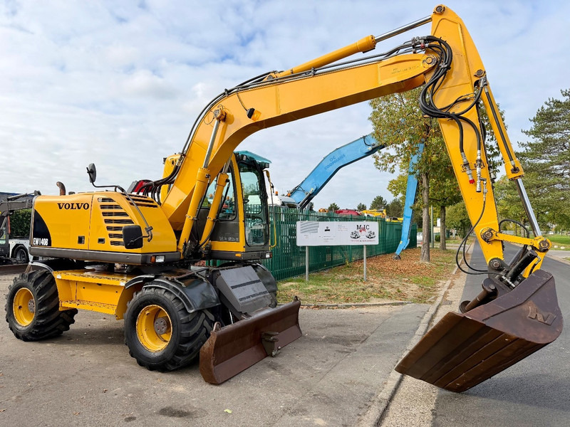 Volvo EW 140 B *FULL HYDR* - BLADE - 10.485h - TILT BUCKET - CE - NL MACHINE - GOOD CONDITION - Mobiele graafmachine: afbeelding 1 Volvo EW 140 B *FULL HYDR* - BLADE - 10.485h - TILT BUCKET - CE - NL MACHINE - GOOD CONDITION - Mobiele graafmachine: afbeelding 1