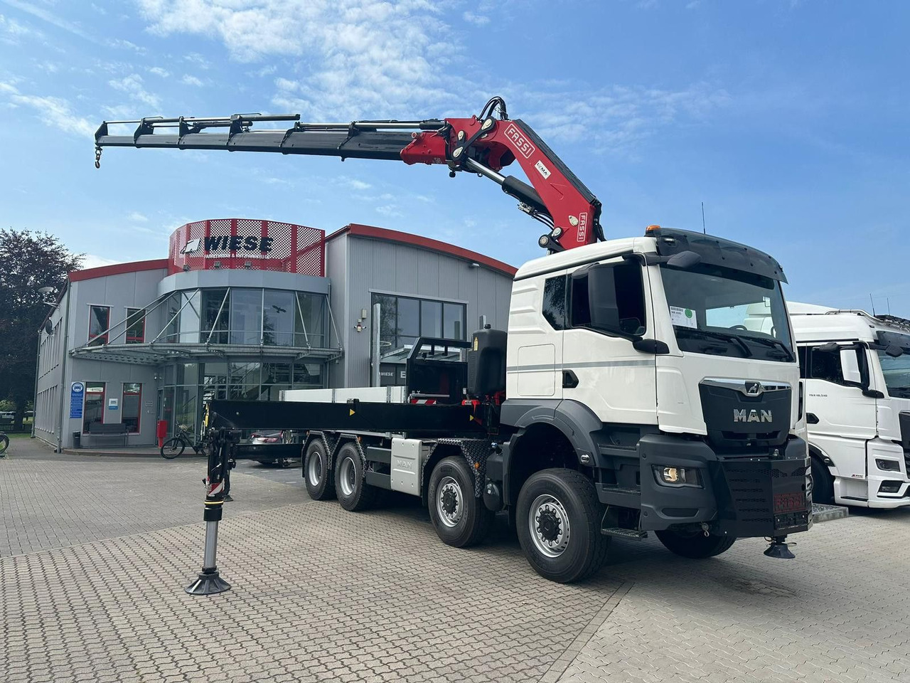 MAN TGS 41.520 8x8 mit Fassi Ladekran F710RA.2.26 - Vrachtwagen met open laadbak: afbeelding 1 MAN TGS 41.520 8x8 mit Fassi Ladekran F710RA.2.26 - Vrachtwagen met open laadbak: afbeelding 1