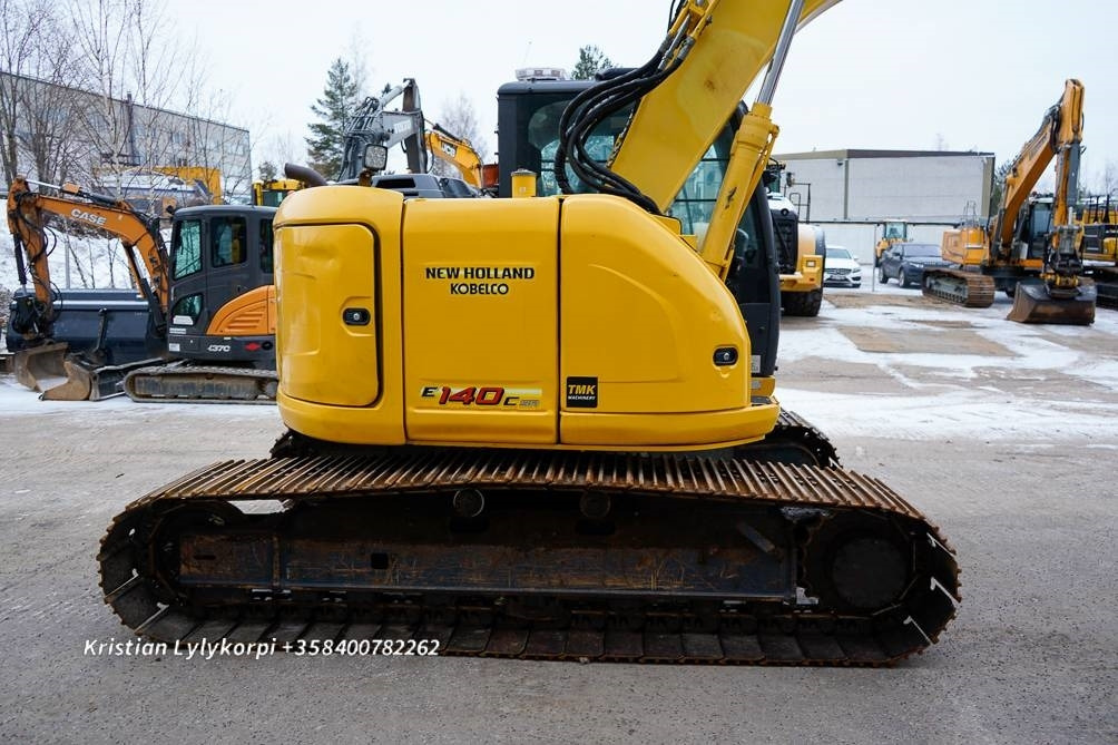 Rupsgraafmachine New Holland E140CSR PYÖRITTÄJÄLLÄ: afbeelding 9