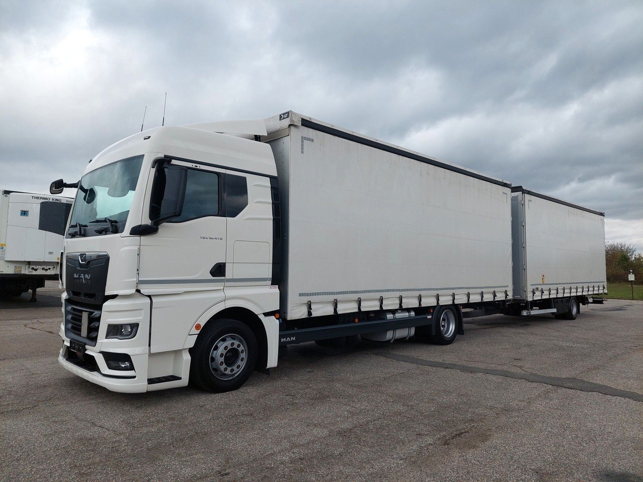 MAN TGX 18.470 LL + Gniotpol G-4080 120 m3 Durchbar - Schuifzeilen vrachtwagen: afbeelding 1 MAN TGX 18.470 LL + Gniotpol G-4080 120 m3 Durchbar - Schuifzeilen vrachtwagen: afbeelding 1