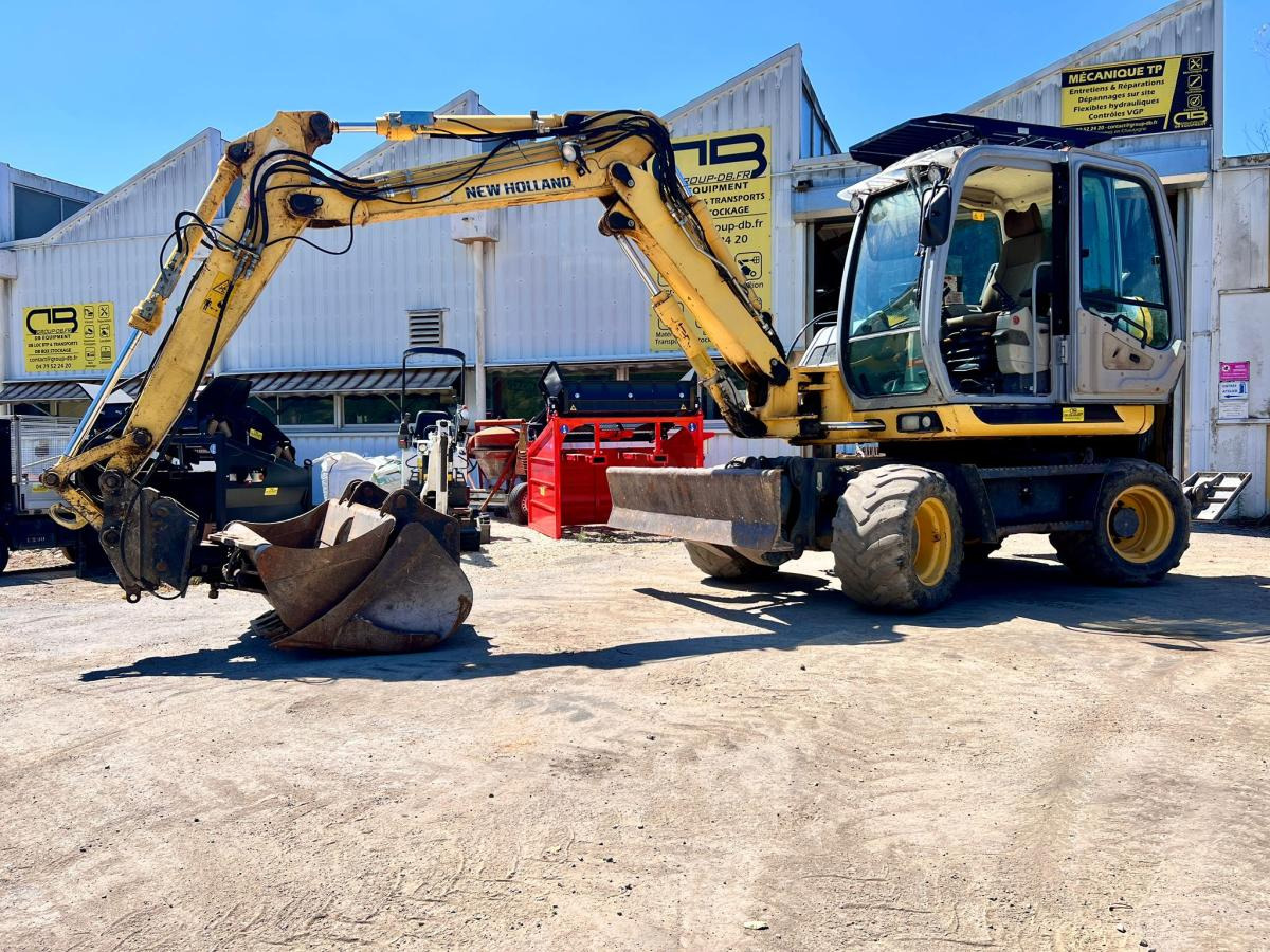 New Holland MH 2.6 PELLE A PNEUS 10T - Mobiele graafmachine: afbeelding 1 New Holland MH 2.6 PELLE A PNEUS 10T - Mobiele graafmachine: afbeelding 1