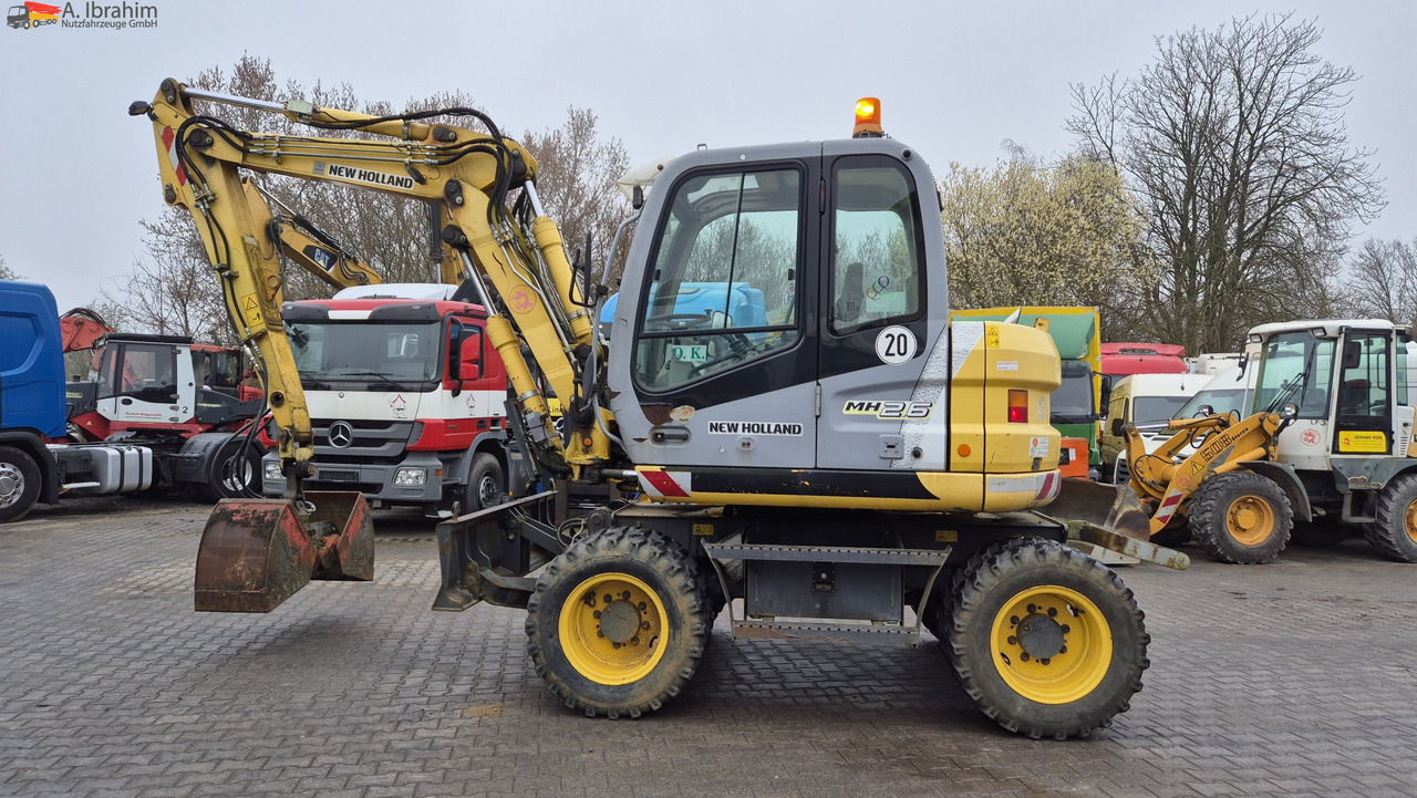 New Holland MH 2.6 Zustand gut, deutsche Maschine incl. Greifer und Dreservo - Mobiele graafmachine: afbeelding 1 New Holland MH 2.6 Zustand gut, deutsche Maschine incl. Greifer und Dreservo - Mobiele graafmachine: afbeelding 1