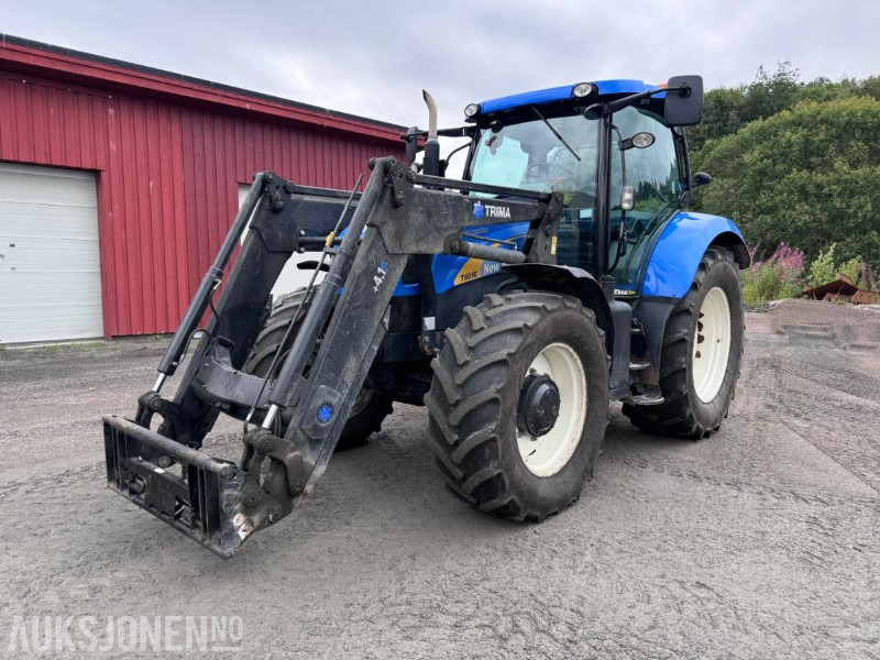 2012 New Holland T6050 med Trima +4.1P frontlaster og panser beskytter - 40 km/t - Tractor: afbeelding 1 2012 New Holland T6050 med Trima +4.1P frontlaster og panser beskytter - 40 km/t - Tractor: afbeelding 1