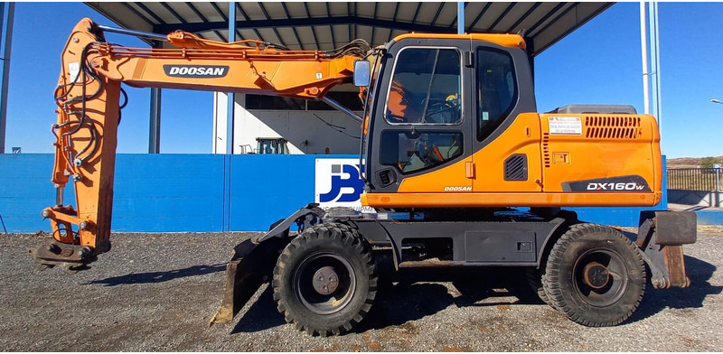 Doosan DX140W-3 - Mobiele graafmachine: afbeelding 1 Doosan DX140W-3 - Mobiele graafmachine: afbeelding 1