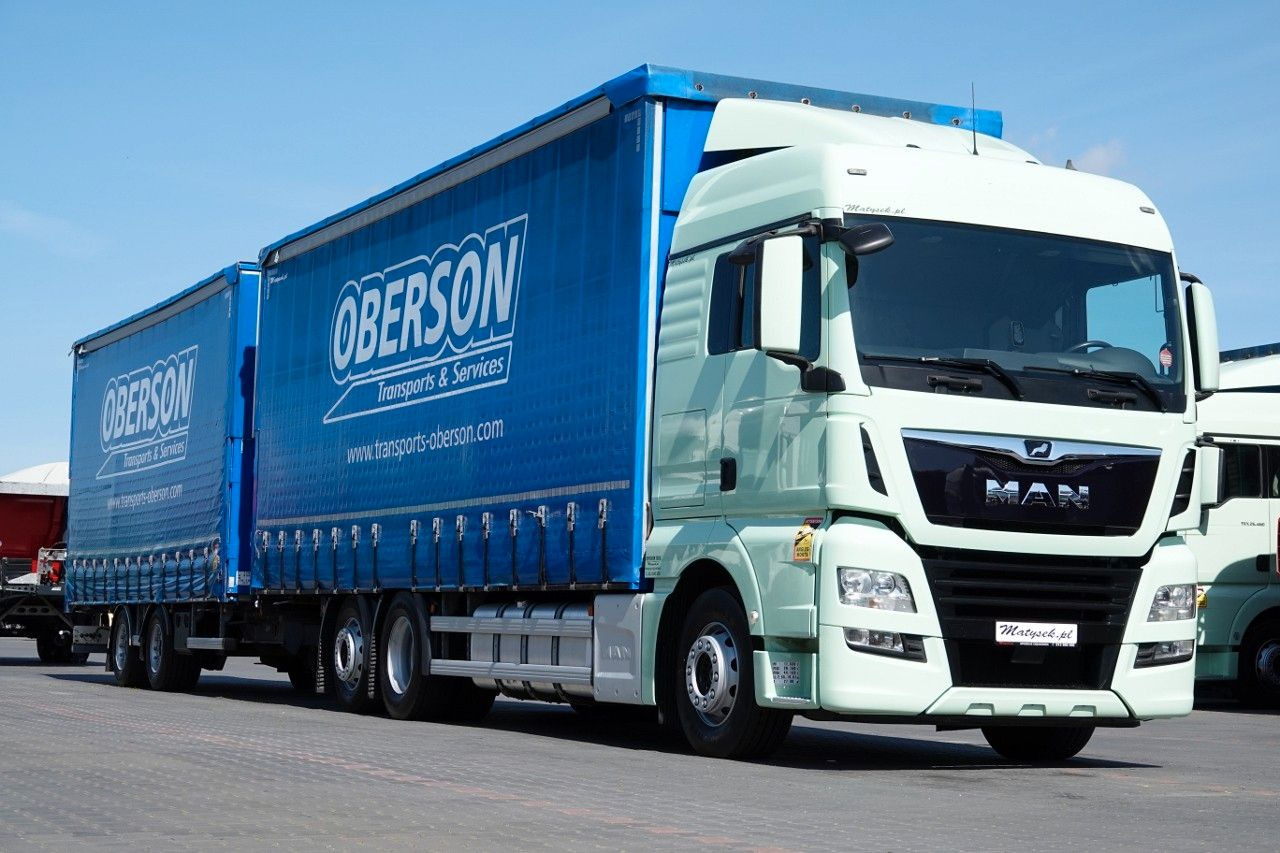 MAN TGX 26.460 / ZESTAW TANDEM PRZEJAZDOWY / 120 M3 - Schuifzeilen vrachtwagen: afbeelding 1 MAN TGX 26.460 / ZESTAW TANDEM PRZEJAZDOWY / 120 M3 - Schuifzeilen vrachtwagen: afbeelding 1