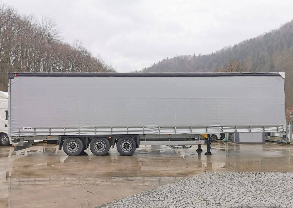Schmitz Cargobull MEGA VARIOS - Schuifzeiloplegger: afbeelding 4 Schmitz Cargobull MEGA VARIOS - Schuifzeiloplegger: afbeelding 4