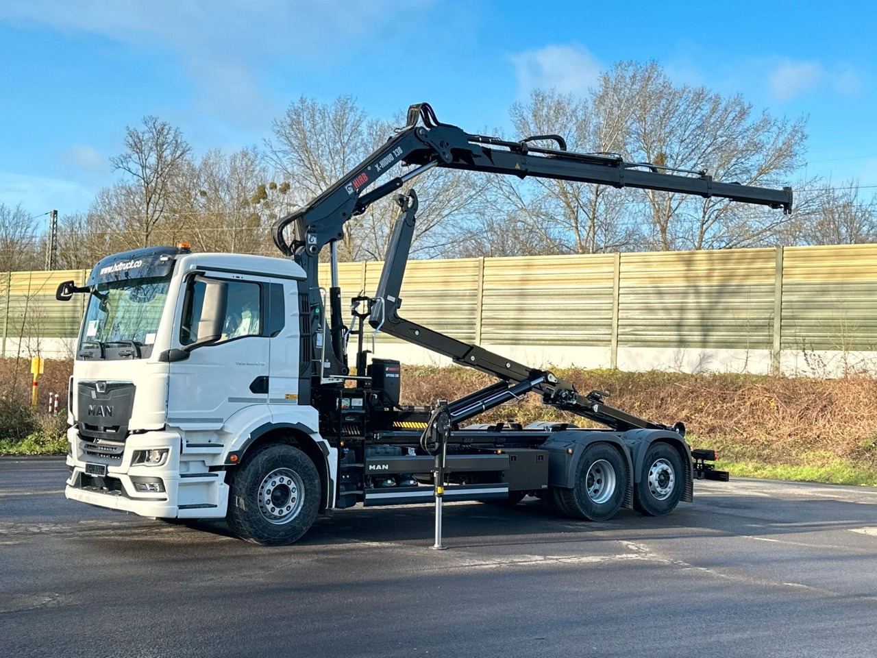 MAN TGS 26.470 6x2 Abrollkipper + Kran Hiab 138-3 - Haakarmsysteem vrachtwagen, Kraanwagen: afbeelding 1 MAN TGS 26.470 6x2 Abrollkipper + Kran Hiab 138-3 - Haakarmsysteem vrachtwagen, Kraanwagen: afbeelding 1