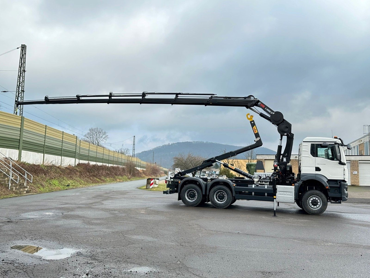 MAN TGS 33.440 6x6 BB Abrollkipper+Kran Hiab 228-6 - Haakarmsysteem vrachtwagen, Kraanwagen: afbeelding 4 MAN TGS 33.440 6x6 BB Abrollkipper+Kran Hiab 228-6 - Haakarmsysteem vrachtwagen, Kraanwagen: afbeelding 4