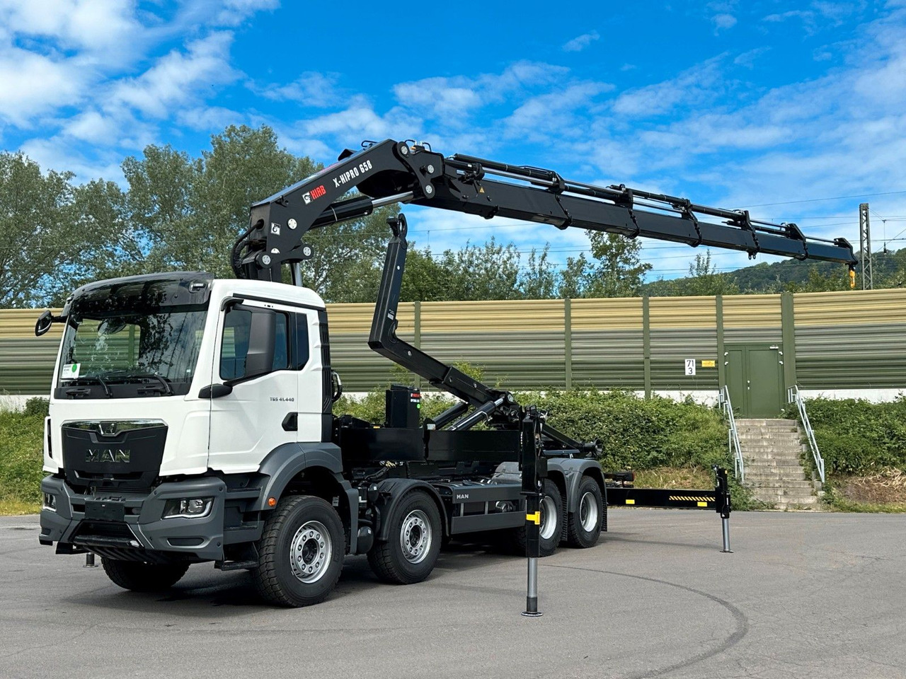 MAN TGS 35.520 8x4 Abrollkipper + Kran HIAB 658E6 - Haakarmsysteem vrachtwagen, Kraanwagen: afbeelding 1 MAN TGS 35.520 8x4 Abrollkipper + Kran HIAB 658E6 - Haakarmsysteem vrachtwagen, Kraanwagen: afbeelding 1