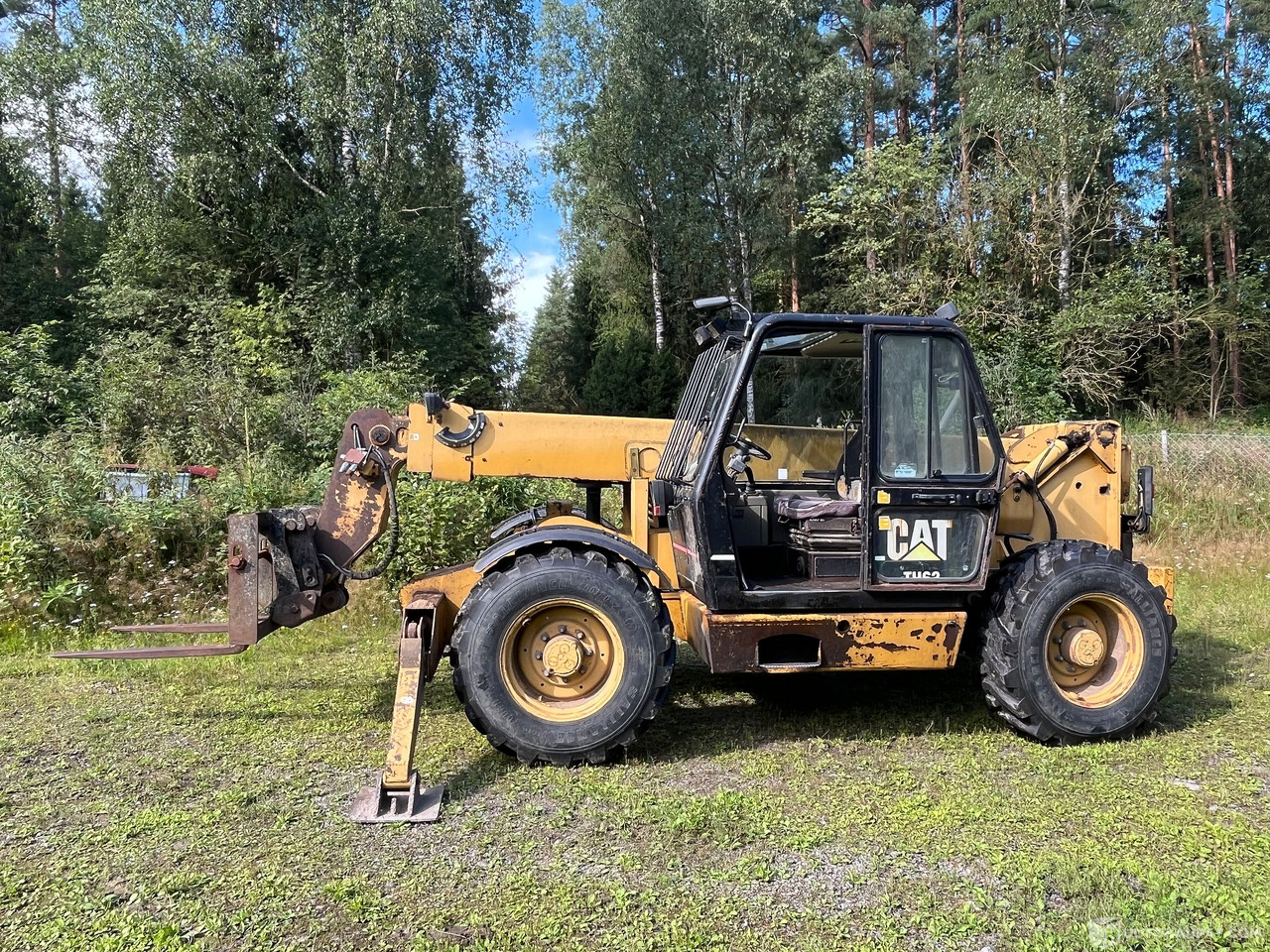 Caterpillar TH63, kurottaja piikeillä ja kauhalla, 2002, Loppi - Landbouwmachine: afbeelding 1 Caterpillar TH63, kurottaja piikeillä ja kauhalla, 2002, Loppi - Landbouwmachine: afbeelding 1