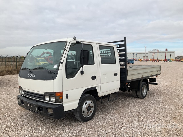 2006 Isuzu NPR77 4x2 Crew Cab Flatbed Truck - Vrachtwagen met open laadbak: afbeelding 1 2006 Isuzu NPR77 4x2 Crew Cab Flatbed Truck - Vrachtwagen met open laadbak: afbeelding 1