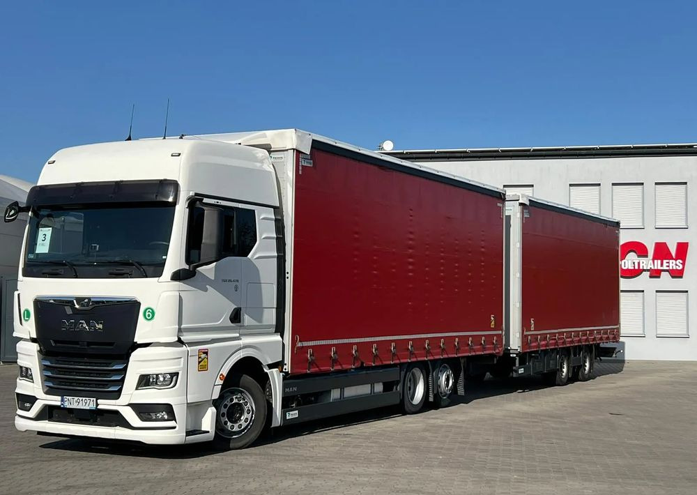 MAN TGX 26.470 z przyczepą Redos - Schuifzeilen vrachtwagen: afbeelding 1 MAN TGX 26.470 z przyczepą Redos - Schuifzeilen vrachtwagen: afbeelding 1