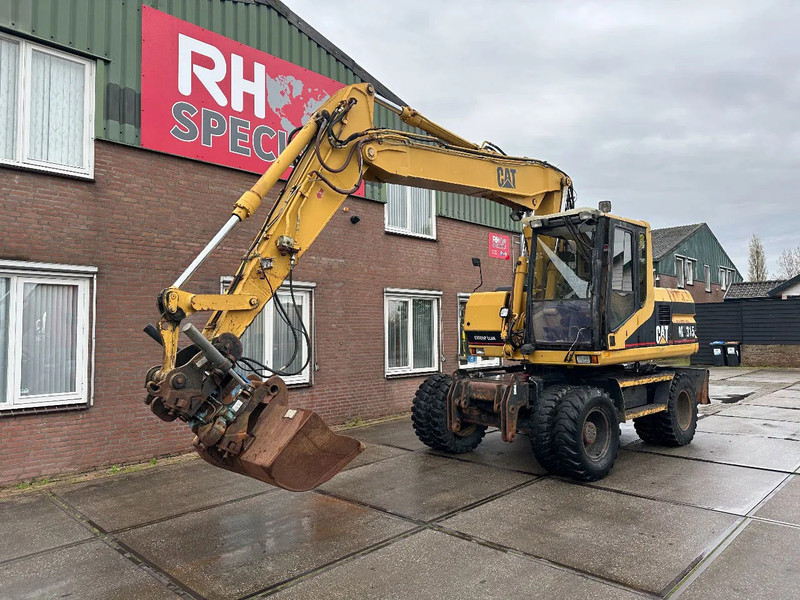 Caterpillar M315 +ROTO CE - Mobiele graafmachine: afbeelding 2 Caterpillar M315 +ROTO CE - Mobiele graafmachine: afbeelding 2