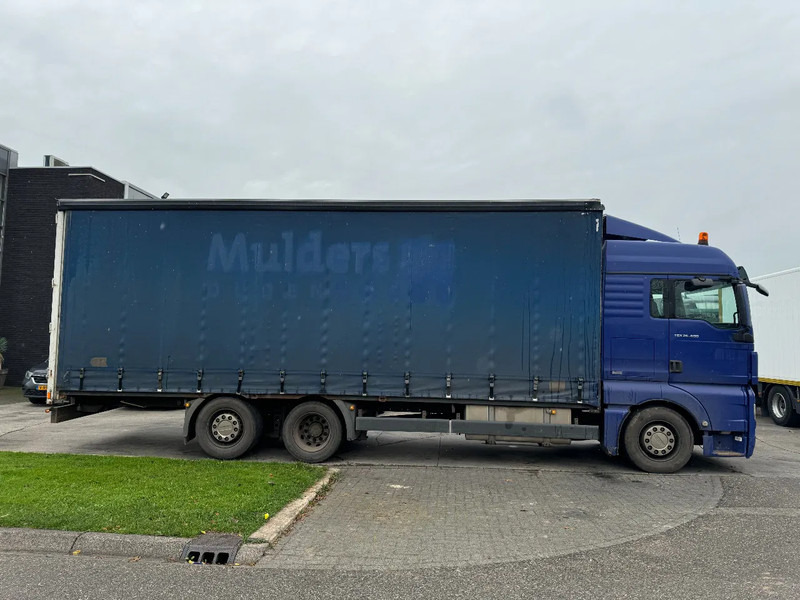 MAN TGX 26.400 6X2 - EURO 4 + LIFT + STEERING AXLE - Schuifzeilen vrachtwagen: afbeelding 4 MAN TGX 26.400 6X2 - EURO 4 + LIFT + STEERING AXLE - Schuifzeilen vrachtwagen: afbeelding 4