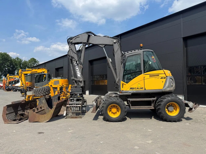 Mecalac 714MW FULL ATTACHMENTS OVERCOMPLEET !!! - Mobiele graafmachine: afbeelding 1 Mecalac 714MW FULL ATTACHMENTS OVERCOMPLEET !!! - Mobiele graafmachine: afbeelding 1