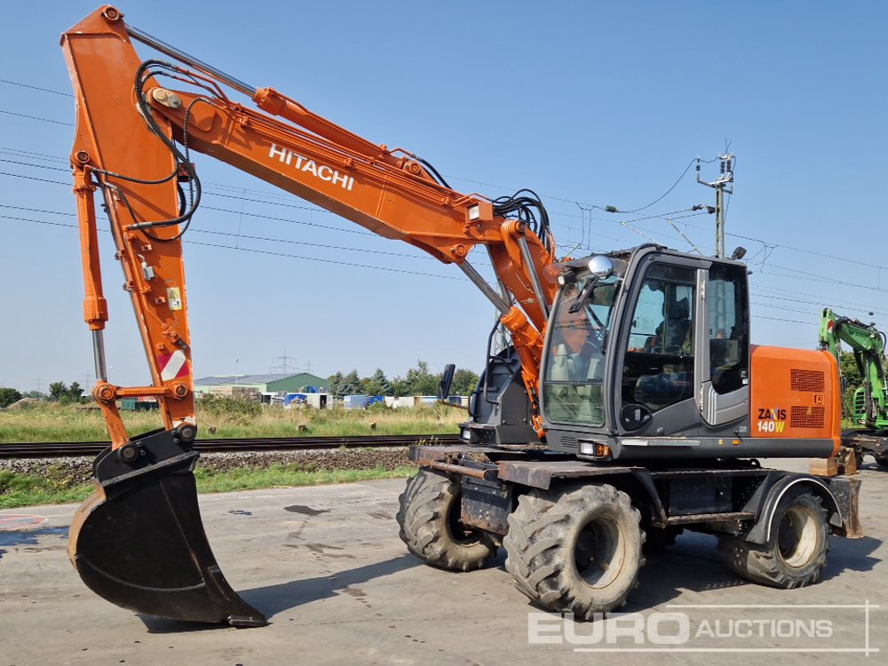 2009 Hitachi ZX140W-3 - Mobiele graafmachine: afbeelding 1 2009 Hitachi ZX140W-3 - Mobiele graafmachine: afbeelding 1