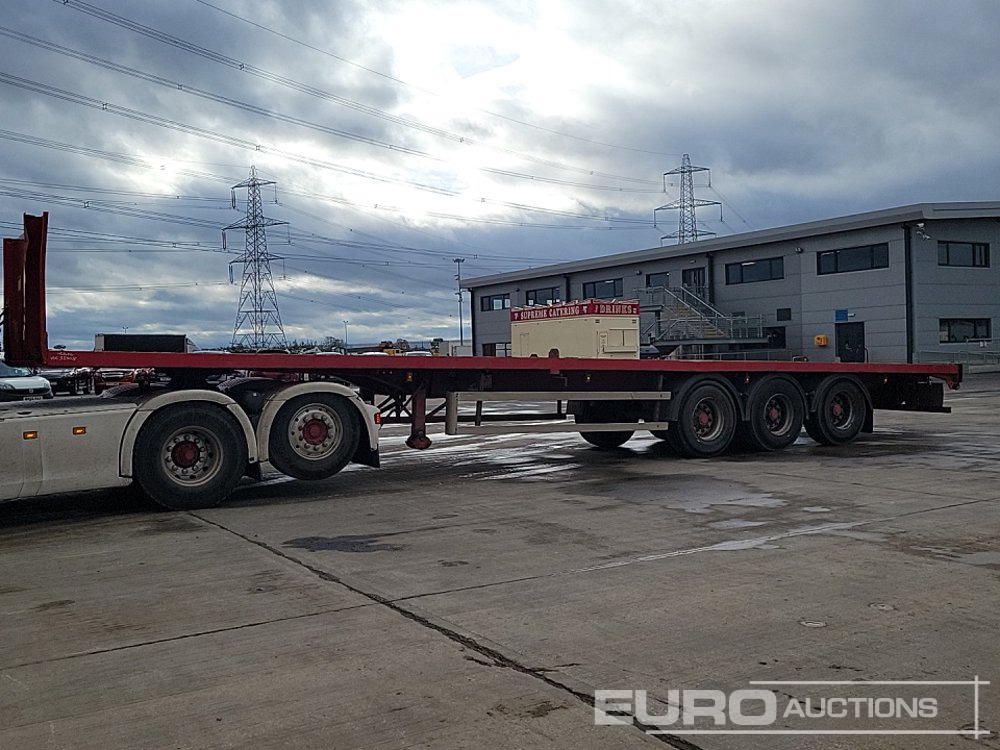 Montracon Tri Axle Flat Bed Trailer - Open bak met boorden oplegger: afbeelding 1 Montracon Tri Axle Flat Bed Trailer - Open bak met boorden oplegger: afbeelding 1